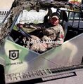 Наёмник за рулем легкого тактического багги «Прометей» с логотипом подразделения на борту, в составе 22-й отдельной механизированной бригады ВСУ.